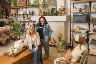 Rusty Rae/News-Register##Anne Nash, left, and Chelsey Nichol are eager to open their new shop at Third and Ford streets on Saturday, May 4. Nash & Nichol offers goods displayed as they might be used in the home. Nash, a designer, said she is happy to make suggestions if people are looking for just the right couch, rug or other piece. The shop also carries local products, such as Bernards Farm jams and Durant Olive Oil.