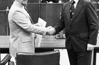 ##John Collins, left, is sworn in as District Attorney by Ed Sullivan, then-county legal counsel,
as former Circuit Judge Kurt Rossman looks on, in this January 1976 News-Register photo