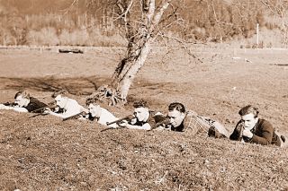 Image: Oregon Historical Society##
A line of Tillamook Guerilla Rifle Club members practice taking up a battle position behind a berm in March 1942, in this photo by an Oregon Journal photographer. Image: Oregon Historical Society##
A line of Tillamook Guerilla Rifle Club members practice taking up a battle position behind a berm in March 1942, in this photo by an Oregon Journal photographer.