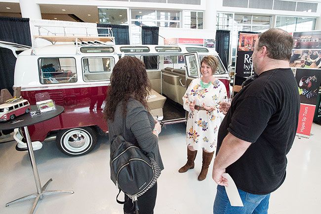 Marcus Larson / News-Register## At the 2018 Sip! Friday, Crystal Laridon talks with Jason Jones and Angie Wall about her companies  hippie themed  wine tours, traveled in a remodeled 1967 VW Bus.