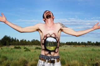 Submitted photo##Body painter Natalie Fletcher used makeup-like paint to create the illusion that scenery can be viewed through a man’s chest. Submitted photo##Body painter Natalie Fletcher used makeup-like paint to create the illusion that scenery can be viewed through a man’s chest.