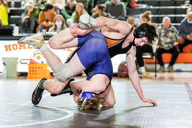 Willamina s Mike Fox in action at the district meet, about to pin another opponent. Fox won a second state title at 160 pounds.