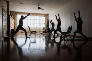 Marcus Larson/News-Register##Teacher Brad Pearson, left, leads yoga poses during a class at 4 Elements. He calls the McMinnville studio “my happy place” where he feels stress-free. Marcus Larson/News-Register##Teacher Brad Pearson, left, leads yoga poses during a class at 4 Elements. He calls the McMinnville studio “my happy place” where he feels stress-free.