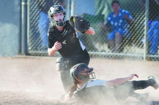 Rusty Rae/News-Register##
McMinnville catcher Kassidee Bates holds up her glove to show the ump she has the ball as she tagged the West Salem runner out. Rusty Rae/News-Register##
McMinnville catcher Kassidee Bates holds up her glove to show the ump she has the ball as she tagged the West Salem runner out.