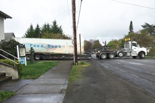 Submitted photo##
Pihl Excavating backs the Yamhill Carlton Storehouse food bank s main space, a shipping container into the First Baptist Church lot. The food bank will reopen May 10 in its new location.