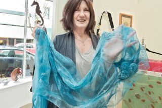 Marcus Larson/News-Register##Patti Bobonich displays a wool and silk scarf at Currents Gallery. She sells a selection of her work at the downtown McMinnville shop. Marcus Larson/News-Register##Patti Bobonich displays a wool and silk scarf at Currents Gallery. She sells a selection of her work at the downtown McMinnville shop.