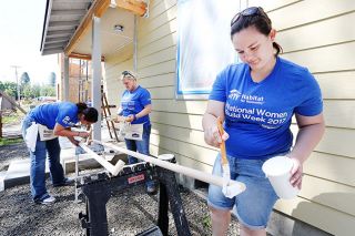 Rockne Roll/News-Register##
From left, Kacey Bales, Jessica Hammons and Karissa Wade paint a trim piece at Habitat For Humanity s Women Build event Wednesday, May 10, in McMinnville. Lowe s workers spent the day helping. Rockne Roll/News-Register##
From left, Kacey Bales, Jessica Hammons and Karissa Wade paint a trim piece at Habitat For Humanity s Women Build event Wednesday, May 10, in McMinnville. Lowe s workers spent the day helping.