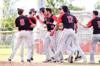 Rockne Roll/News-Register##
McMinnville designated hitter Nathan Leid, second from left, celebrates with teammates after his walk-off RBI single in the Grizzlies’ GVC Championship-clenching win over South Salem Wednesday on the Grizzlies home field. Rockne Roll/News-Register##
McMinnville designated hitter Nathan Leid, second from left, celebrates with teammates after his walk-off RBI single in the Grizzlies’ GVC Championship-clenching win over South Salem Wednesday on the Grizzlies home field.