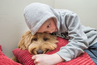 Marcus Larson/News-Register##
Faulconer-Chapman School student Caiden Trotter and Padme, the Sheridan school s therapy dog, enjoy some quiet time together. Marcus Larson/News-Register##
Faulconer-Chapman School student Caiden Trotter and Padme, the Sheridan school s therapy dog, enjoy some quiet time together.