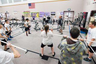 Marcus Larson/News-Register##
McMinnville Crossfit instructor J.P. Kloninger teaches Duniway students Olympic-style lifts. Crossfit is one of several workouts volunteer instructors are teaching to middle schoolers. Marcus Larson/News-Register##
McMinnville Crossfit instructor J.P. Kloninger teaches Duniway students Olympic-style lifts. Crossfit is one of several workouts volunteer instructors are teaching to middle schoolers.
