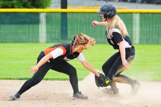 Rusty Rae/News-Register##
Lexie McKinley is tagged out on her way to third base after hard ground ball by Sydnee Rusty Rae/News-Register##
Lexie McKinley is tagged out on her way to third base after hard ground ball by Sydnee