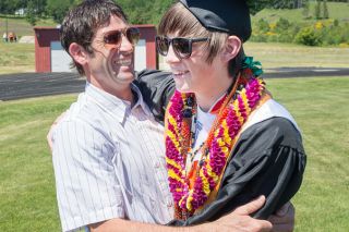 Marcus Larson/News-Register##
Willamina graduate Justin Fasana shares a celebratory hug with his father and Willamina High teacher Ariah Fasana at the conclusion of the ceremony. Marcus Larson/News-Register##
Willamina graduate Justin Fasana shares a celebratory hug with his father and Willamina High teacher Ariah Fasana at the conclusion of the ceremony.