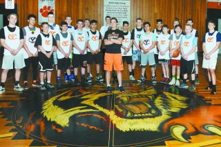 Rusty Rae/News-Register##
Newly-hired Heather Roberts with Y-C boys’ basketball team members prior to a summer practice session at Y-C. Rusty Rae/News-Register##
Newly-hired Heather Roberts with Y-C boys’ basketball team members prior to a summer practice session at Y-C.