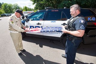 Marcus Larson/News-Register
Veteran Angel Mendoza and McMinnville Police officer Mike LaRue properly fold an American flag to be used for the new police program that aims to give deceased veterans the honor they deserve. Marcus Larson/News-Register
Veteran Angel Mendoza and McMinnville Police officer Mike LaRue properly fold an American flag to be used for the new police program that aims to give deceased veterans the honor they deserve.