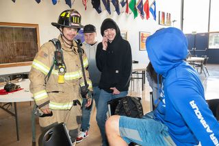 Rusty Rae/News-Register##Sheridan Fire District Chief Les Thomas talks to students about the firefighting/emergency medical services profession at the Sheridan High School Future Fair event.
