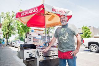 Marcus Larson/News-Register##A former cook on Navy submarines, Donn Wetmore is trying his hand on land. He serves whiskey-marinated bratwurst and double-smoked sausage from his hot dog cart in downtown Newberg. Marcus Larson/News-Register##A former cook on Navy submarines, Donn Wetmore is trying his hand on land. He serves whiskey-marinated bratwurst and double-smoked sausage from his hot dog cart in downtown Newberg.