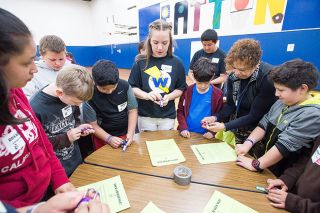 Marcus Larson/News-Register##
Patton Middle School seventh-grader Nora Nichol, center, shows a group of fifth graders how to open and close a combination lock. They will need to open their P.E. lockers next year. Marcus Larson/News-Register##
Patton Middle School seventh-grader Nora Nichol, center, shows a group of fifth graders how to open and close a combination lock. They will need to open their P.E. lockers next year.