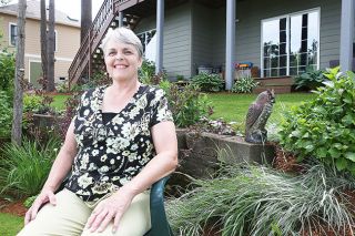 Rockne Roll/News-Register##Teresa Brandon, pictured in the lower portion of her yard in McMinnville. Rockne Roll/News-Register##Teresa Brandon, pictured in the lower portion of her yard in McMinnville.