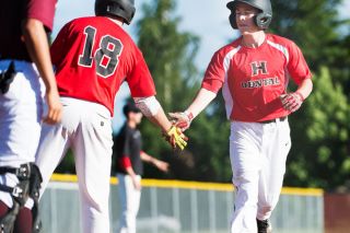 Marcus Larson/News-Register##
Ian Wilson gets a low five from a teammate as he comes home with the first run of the game, on a balk by the Forest Grove pitcher. Marcus Larson/News-Register##
Ian Wilson gets a low five from a teammate as he comes home with the first run of the game, on a balk by the Forest Grove pitcher.