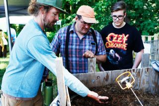 Rockne Roll/News-Register##Clay Wesson, left, shows his recently started compost pile to Joe and Nicholas Bernards during Zero Waste McMinnville’s Compostpalooza event held Saturday, June 16, at the McMinnville Grange. Rockne Roll/News-Register##Clay Wesson, left, shows his recently started compost pile to Joe and Nicholas Bernards during Zero Waste McMinnville’s Compostpalooza event held Saturday, June 16, at the McMinnville Grange.
