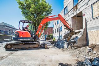 Marcus Larson/News-Register##
Brian Griffin from Power Concrete Cutting & Demolition Inc. uses a mini excavator to break apart large blocks of concrete during the old hosital building demolition. Marcus Larson/News-Register##
Brian Griffin from Power Concrete Cutting & Demolition Inc. uses a mini excavator to break apart large blocks of concrete during the old hosital building demolition.