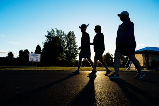 Marcus Larson/News-Register##Participants in this year’s Relay for Life fundraiser walk around the Patton Middle School track as the sun sets. This year’s event ran from noon to midnight Saturday, June 23. Marcus Larson/News-Register##Participants in this year’s Relay for Life fundraiser walk around the Patton Middle School track as the sun sets. This year’s event ran from noon to midnight Saturday, June 23.
