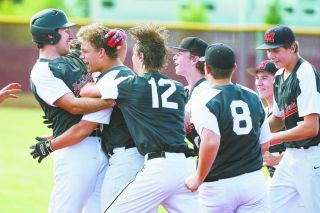 Marcus Larson/News-Register##
Brantley Seehawer is mobbed by Hyder Dental players after his game-winning hit against Sprague Saturday. Marcus Larson/News-Register##
Brantley Seehawer is mobbed by Hyder Dental players after his game-winning hit against Sprague Saturday.