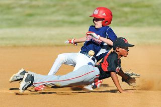 Rusty Rae/News-Register##
Bryce Wilson dives for a throw from the Mac catcher during action against Westview in the state tournament. Rusty Rae/News-Register##
Bryce Wilson dives for a throw from the Mac catcher during action against Westview in the state tournament.