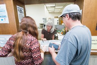 Marcus Larson/News-Register##
Samantha Crump and her father David, get assistance from Karen Holland with renewing her expired passport. Marcus Larson/News-Register##
Samantha Crump and her father David, get assistance from Karen Holland with renewing her expired passport.