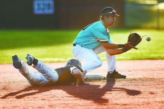 Rusty Rae/News-Register##
Colton Smith dives back to second base on a pick-off play in the seventh inning. He was safe and went on to score the winning run on Brett Lundeen’s single, putting Mac into the state tourney. Rusty Rae/News-Register##
Colton Smith dives back to second base on a pick-off play in the seventh inning. He was safe and went on to score the winning run on Brett Lundeen’s single, putting Mac into the state tourney.
