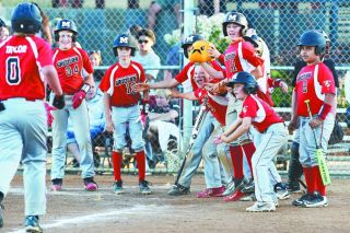Rusty Rae/News-Register##
McMinnville’s JBO Junior American team greets Mitchell Taylor after his three-run homer against Gladstone in a 21-5 win in the state tourney. Mac eventually finished second in state. Rusty Rae/News-Register##
McMinnville’s JBO Junior American team greets Mitchell Taylor after his three-run homer against Gladstone in a 21-5 win in the state tourney. Mac eventually finished second in state.