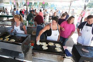 News-Register file photo##
Fire district volunteers successfully took the reins of the Amity Pancake Breakfast last year, drawing more than 1,000 people to City Park. They’ll be back at it Sunday for the 60th annual event. News-Register file photo##
Fire district volunteers successfully took the reins of the Amity Pancake Breakfast last year, drawing more than 1,000 people to City Park. They’ll be back at it Sunday for the 60th annual event.