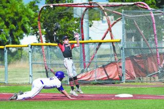 Rusty Rae/News-Register##
McMinnville first baseman Braden Woods leaps for a high throw from the Grizzlies’ catcher on a pick-off attempt. The errant throw opened the door for several Sunset runs to score. Rusty Rae/News-Register##
McMinnville first baseman Braden Woods leaps for a high throw from the Grizzlies’ catcher on a pick-off attempt. The errant throw opened the door for several Sunset runs to score.