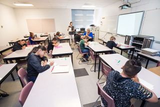 Marcus Larson/News-Register##Duniway teacher Cyndi Havercroft and Principal Hilary Brittan-Lack help students with math problems during summer class. Marcus Larson/News-Register##Duniway teacher Cyndi Havercroft and Principal Hilary Brittan-Lack help students with math problems during summer class.
