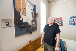 Marcus Larson/News-Register##Artist Adam Rupniewski discusses one of his favorite pieces, titled “Lofty Room.” It’s his jazzy interpretation of “A Man Seated Reading at a Table in a Lofty Room” created by one of Rembrandt’s pupils. Marcus Larson/News-Register##Artist Adam Rupniewski discusses one of his favorite pieces, titled “Lofty Room.” It’s his jazzy interpretation of “A Man Seated Reading at a Table in a Lofty Room” created by one of Rembrandt’s pupils.