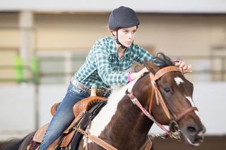 Rockne Roll/News-Register##Stephanie Rosenbalm competes in 4-H Senior Pole Bending at the Yamhill County Fair on Friday. Rockne Roll/News-Register##Stephanie Rosenbalm competes in 4-H Senior Pole Bending at the Yamhill County Fair on Friday.