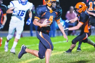 Marcus Larson/News-Register file photo##
Jaime Garcia, pictured in a game against Valley Catholic last season, returns as the starting quarterback for the Tigers. He is a dual-threat at the position, using his speed and arm strength to defeat defenses. Marcus Larson/News-Register file photo##
Jaime Garcia, pictured in a game against Valley Catholic last season, returns as the starting quarterback for the Tigers. He is a dual-threat at the position, using his speed and arm strength to defeat defenses.