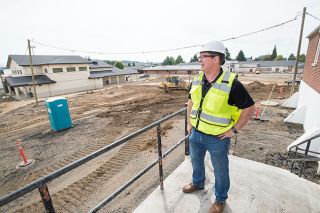 Marcus Larson/News-Register##Superintendent Charan Cline describes the extensive construction at Yamhill-Carlton High School. An 800-seat gym and a career-tech center, both round, domed buildings, are among additions. Marcus Larson/News-Register##Superintendent Charan Cline describes the extensive construction at Yamhill-Carlton High School. An 800-seat gym and a career-tech center, both round, domed buildings, are among additions.