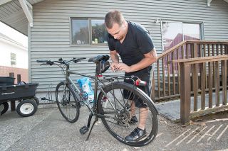 Marcus Larson/News-Register##
Juan Loredo shows off his newest bike, and details several useful tools he keeps with him to repair it on the fly. Marcus Larson/News-Register##
Juan Loredo shows off his newest bike, and details several useful tools he keeps with him to repair it on the fly.