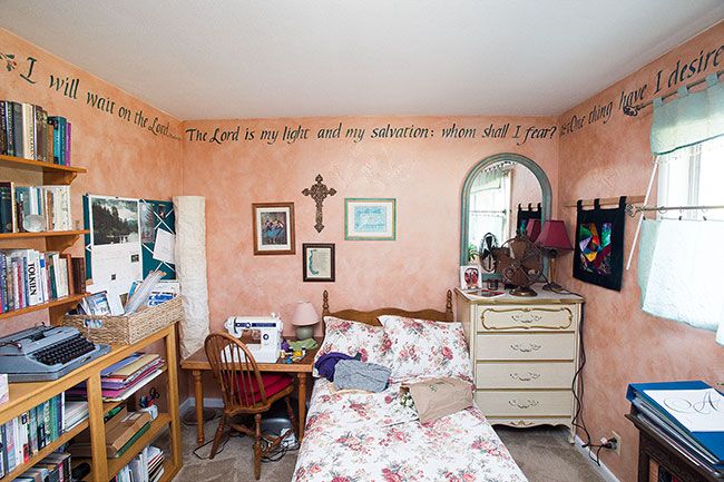 Marcus Larson/News-Register##Susan Newby converted her daughter’s former bedroom into a sewing room, encircling the space with her calligraphy.