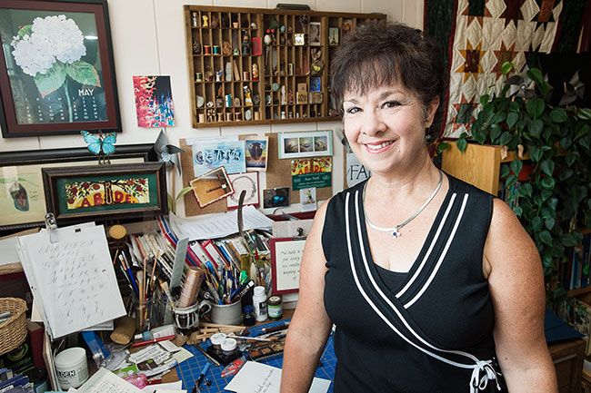Marcus Larson/News-Register##Susan Newby, pictured in the workroom of her McMinnville home, has been practicing calligraphy since high school. “Everybody should find a way to be creative,” she said.