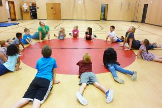 Starla Pointer / News-Register
Children stretch like cobras in a P.E. session led by Rachel Sunny
Sundquist and Megan Cunningham at Newby School. Starla Pointer / News-Register
Children stretch like cobras in a P.E. session led by Rachel Sunny
Sundquist and Megan Cunningham at Newby School.