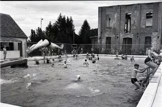 ##Youngsters dive and frolic in the concrete pool on Star Mill Way in 1947, with the old mill still standing in the background. The pool was built in 1934 with help from the Works Progress Administration. Swimmers loved it, despite the cold water. ##Youngsters dive and frolic in the concrete pool on Star Mill Way in 1947, with the old mill still standing in the background. The pool was built in 1934 with help from the Works Progress Administration. Swimmers loved it, despite the cold water.