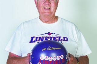 Marcus Larson/News-Register##
Linfield Hall of Fame coach Ad Rutschman poses with the helmet that will be a part of the Barium Cup auction. Rutschman will also speak at the banquet after the golf tournament. Marcus Larson/News-Register##
Linfield Hall of Fame coach Ad Rutschman poses with the helmet that will be a part of the Barium Cup auction. Rutschman will also speak at the banquet after the golf tournament.