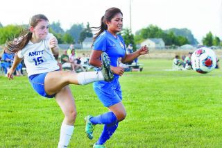 Rockne Roll/News-Register##
Amity midfielder Keeley Graham, 15, lofts in a cross in the Warriors’ match against Gervais. Graham scored goal on a header as the Warriors earned their first win of the season with a 4-1 score. Rockne Roll/News-Register##
Amity midfielder Keeley Graham, 15, lofts in a cross in the Warriors’ match against Gervais. Graham scored goal on a header as the Warriors earned their first win of the season with a 4-1 score.