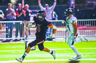 Marcus Larson/News-Register##
McMinnville’s Colton Smith scampers into the end zone with the winning score on a 20-yard catch and run with 17 seconds left in the game. McMinnville downed North Salem 34-28 Friday at Wortman Stadium. Marcus Larson/News-Register##
McMinnville’s Colton Smith scampers into the end zone with the winning score on a 20-yard catch and run with 17 seconds left in the game. McMinnville downed North Salem 34-28 Friday at Wortman Stadium.