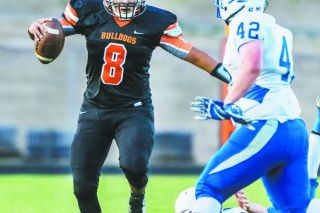 Malia Riggs/for the News-Register##
Willamina quarterback Brad Milton (8) runs for a first down late in the first quarter as the Bulldogs upset Amity, 16-13. Malia Riggs/for the News-Register##
Willamina quarterback Brad Milton (8) runs for a first down late in the first quarter as the Bulldogs upset Amity, 16-13.