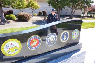 Starla Pointer / News-Register##
American Legion member Juan Palacios looks at the back of the memorial to the Army, Navy, Air Force, Marines and Coast Guard. Starla Pointer / News-Register##
American Legion member Juan Palacios looks at the back of the memorial to the Army, Navy, Air Force, Marines and Coast Guard.