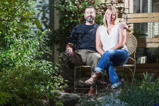 Rockne Roll/News-Register##Eric and Carly Baughman, pictured in their Yard of the Month-winning front yard in McMinnville Wednesday, Sept. 13. Carly says maintaining the front and back yards takes over two hours of hand watering each day. Rockne Roll/News-Register##Eric and Carly Baughman, pictured in their Yard of the Month-winning front yard in McMinnville Wednesday, Sept. 13. Carly says maintaining the front and back yards takes over two hours of hand watering each day.