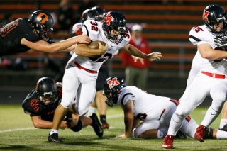 Photo courtesy of Molly Smith/Statesman Journal##
McMinnville tailback Ray Jacob looks for running room in the first half of the Grizzlies 47-7 loss to Sprague. Photo courtesy of Molly Smith/Statesman Journal##
McMinnville tailback Ray Jacob looks for running room in the first half of the Grizzlies 47-7 loss to Sprague.